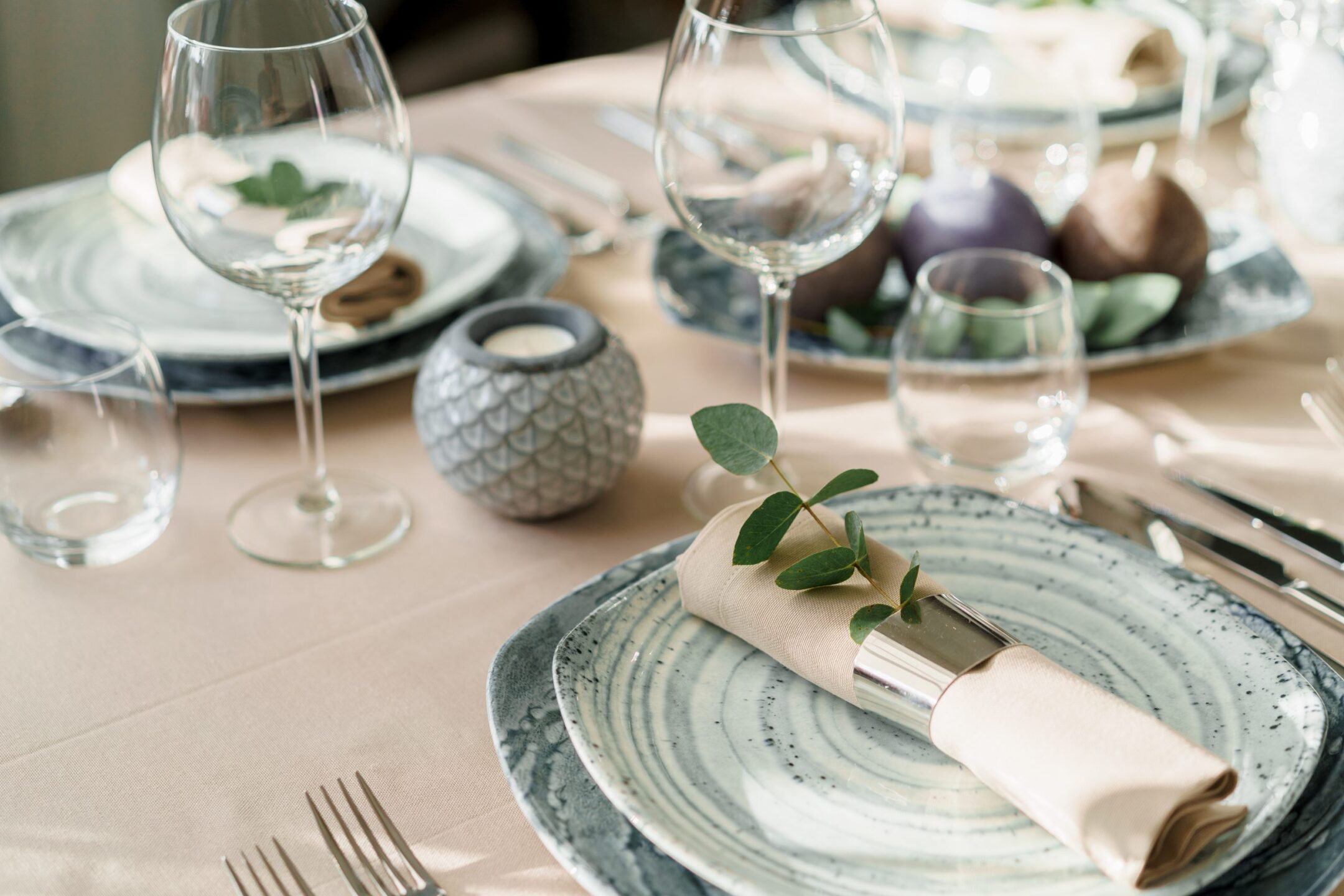 Luxury table setting for dining in pastel colors close up